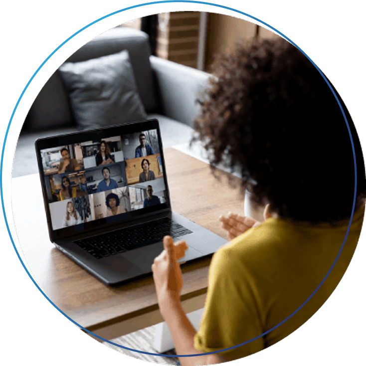 Woman talking to some colleagues in an online business meeting while working at home